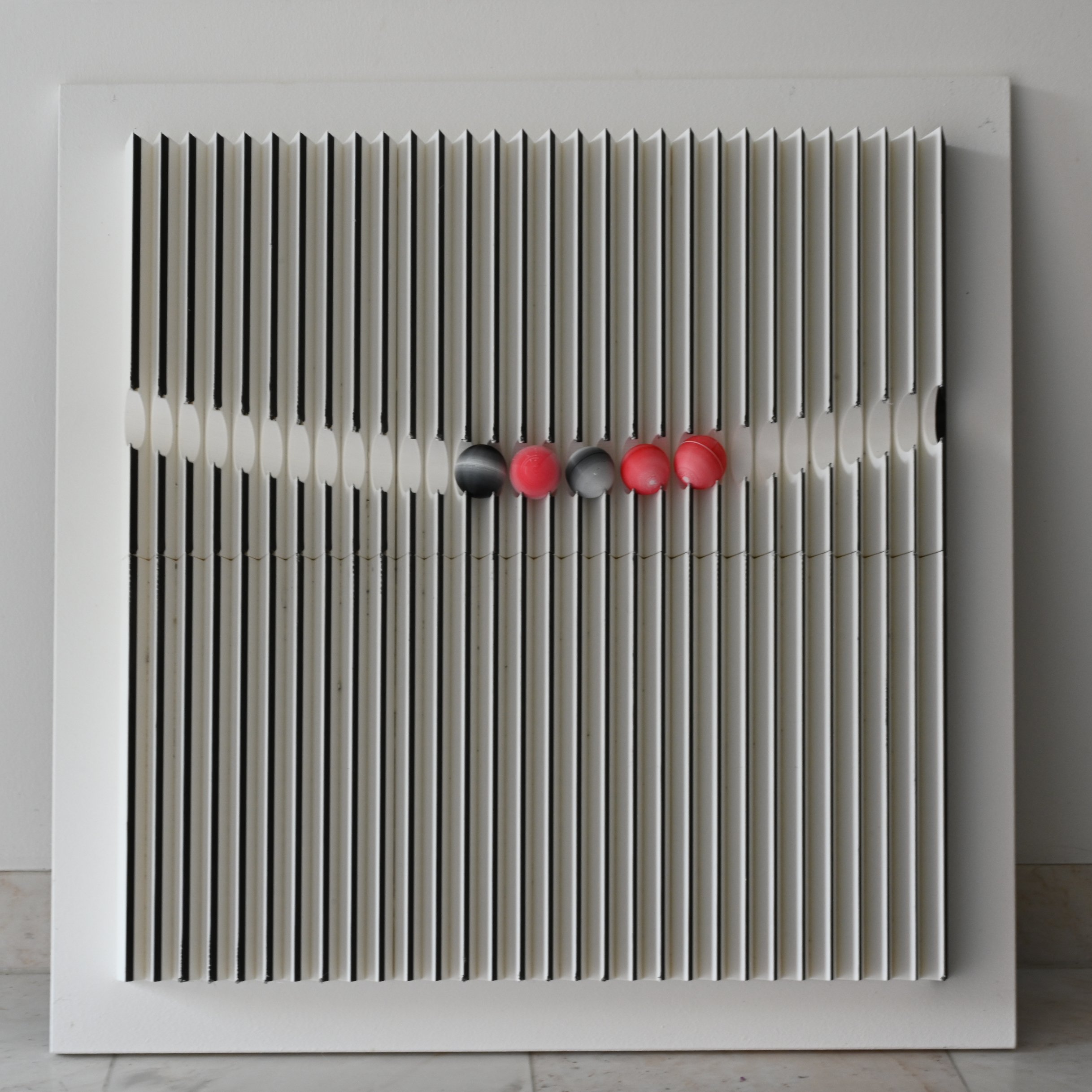 changing perspective lenticular wall sculpture – front view