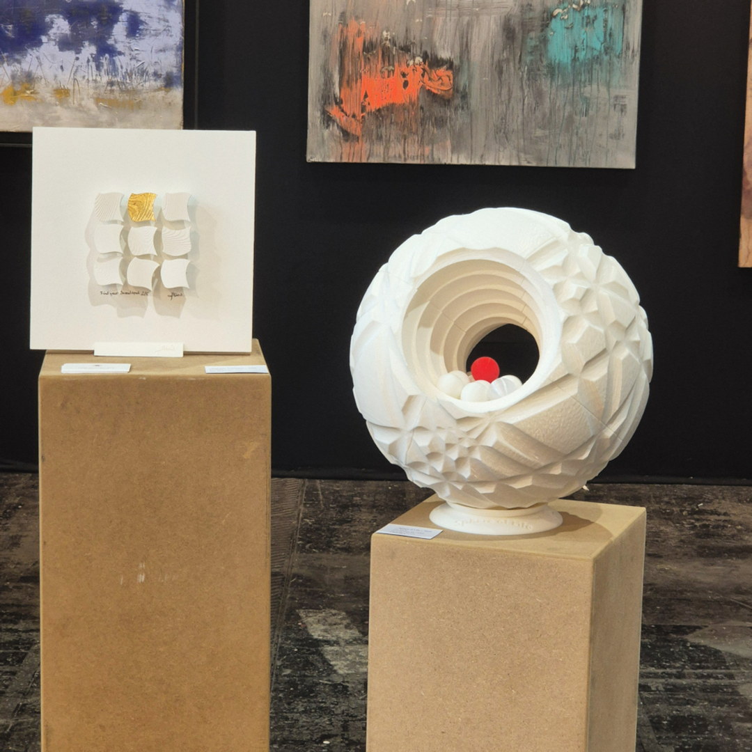 sculpture sphere of life with its red sphere and sculpture find your sweetspot by ivo meier at art3f paris 2026