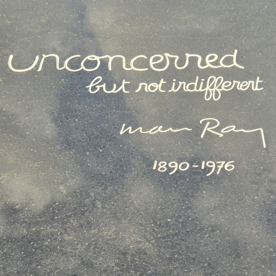 grave of man ray at montparnasse cemetery, paris – epitaph unconcerned, but not indifferent